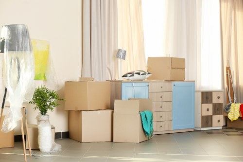Packed boxes and furniture ready for transport