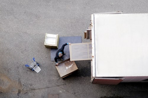 Crew coordinating a safe furniture lift during a move