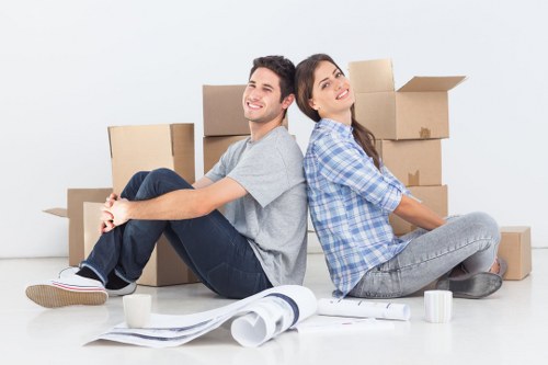 Commercial movers organising boxes and furniture for an office move