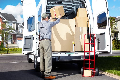 Loading boxes and furniture into a moving truck in Harringay