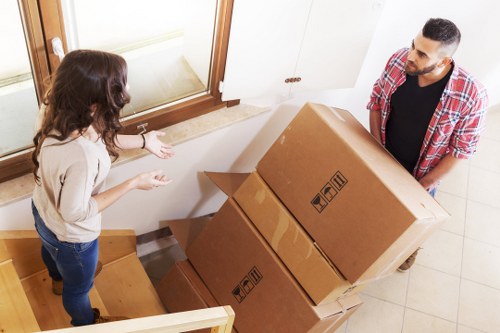 Loading household boxes into a Harringay removal van
