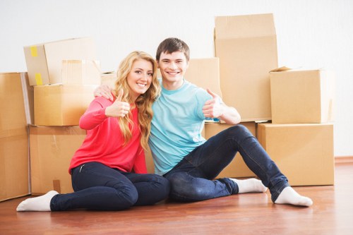 Professional movers handling household furniture in Harringay