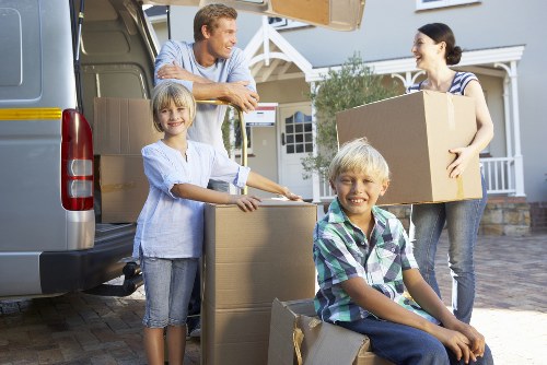Packed moving boxes and furniture ready for removals in Harringay